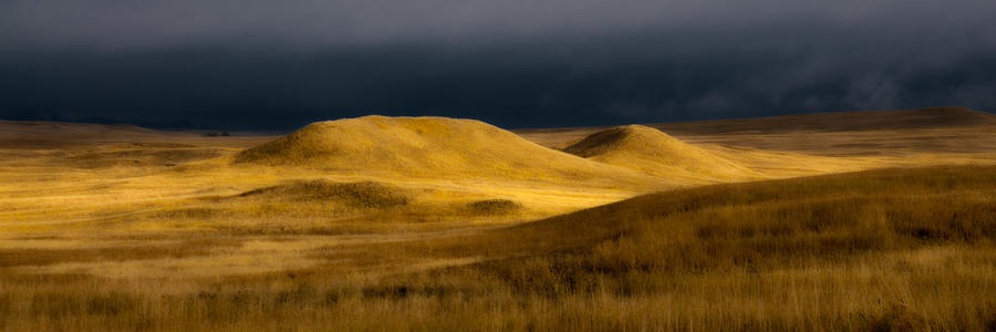 Pic 1. storm-clouds-over-the-prairie-badlands-national-park-ron-mcginnis